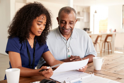 adult woman and senior man talking about health